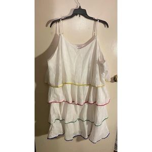 White linen style dress with layers and multi colored trim.